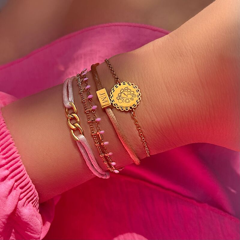 Gouden en roze armbanden mix