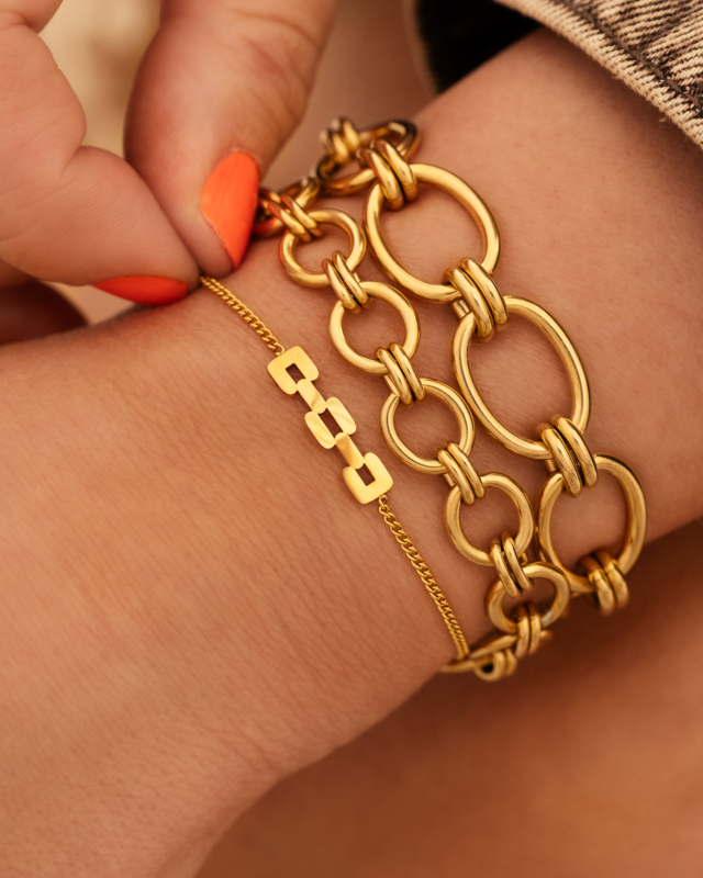 Gouden armparty met chains
