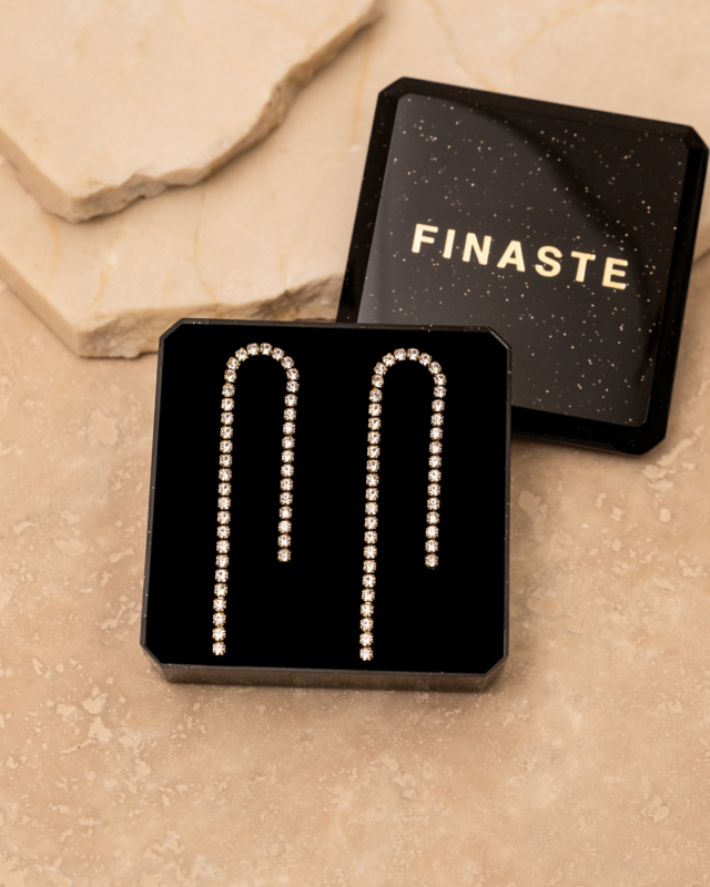 Tennis oorbellen goud in sieradendoosje