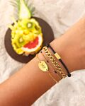 goudkleurige armparty met zwarte details