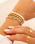 Gouden armparty met witte details