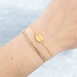 Gouden armparty met schakelarmbandje met kleedje