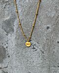 gouden ketting met bolletjes en gravering