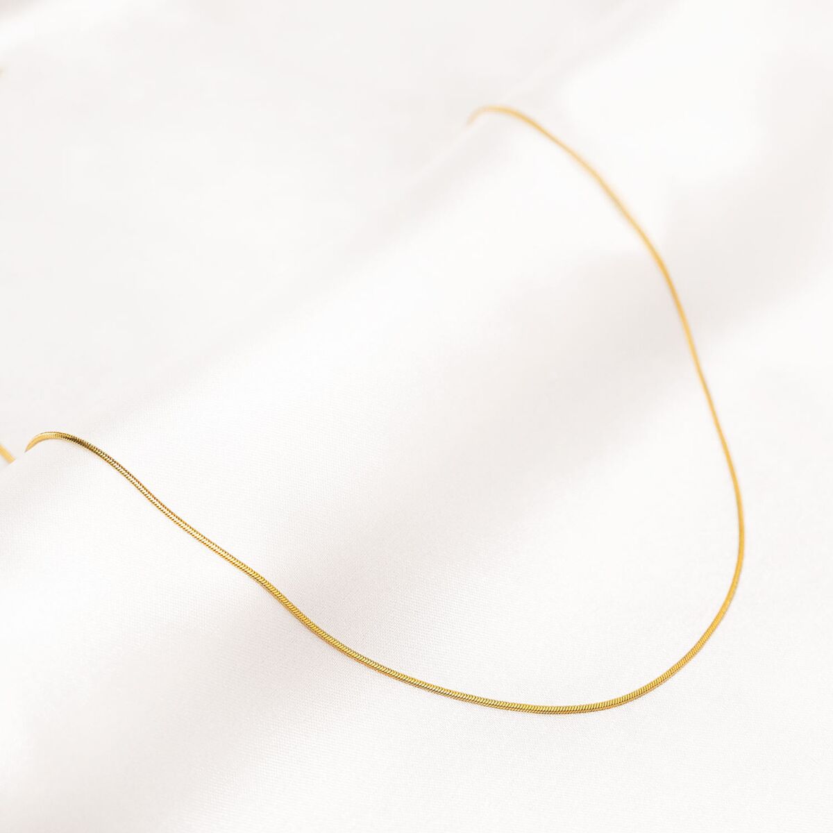 Gouden schakelketting met snake chains