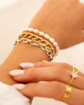 Gouden armparty met witte details