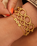 Gouden armparty met chains