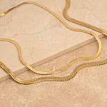 Platte snake ketting goudkleurig
