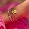 Gouden en roze armbanden mix